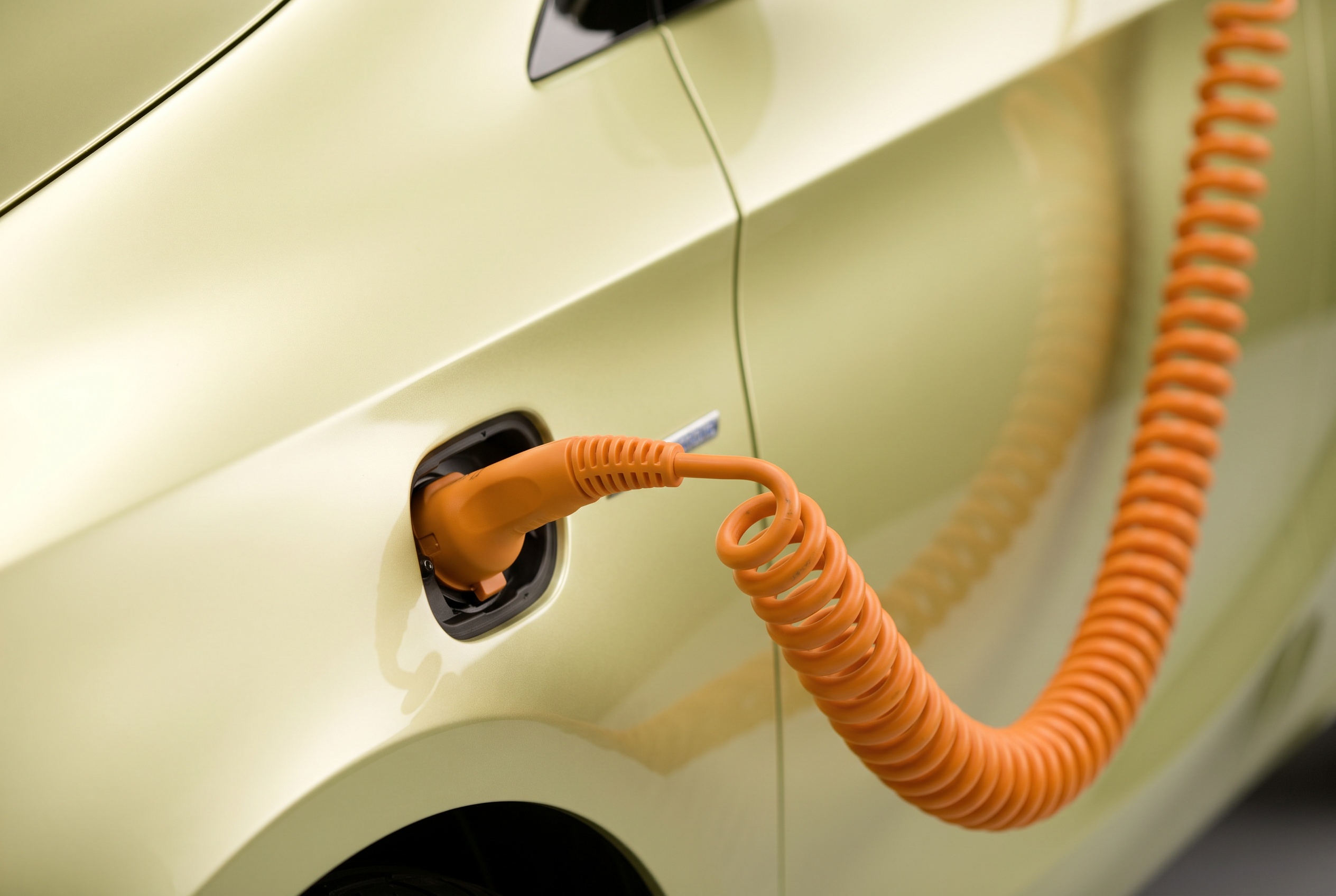 Close-up of the BlueZERO's coiled orange charging cable