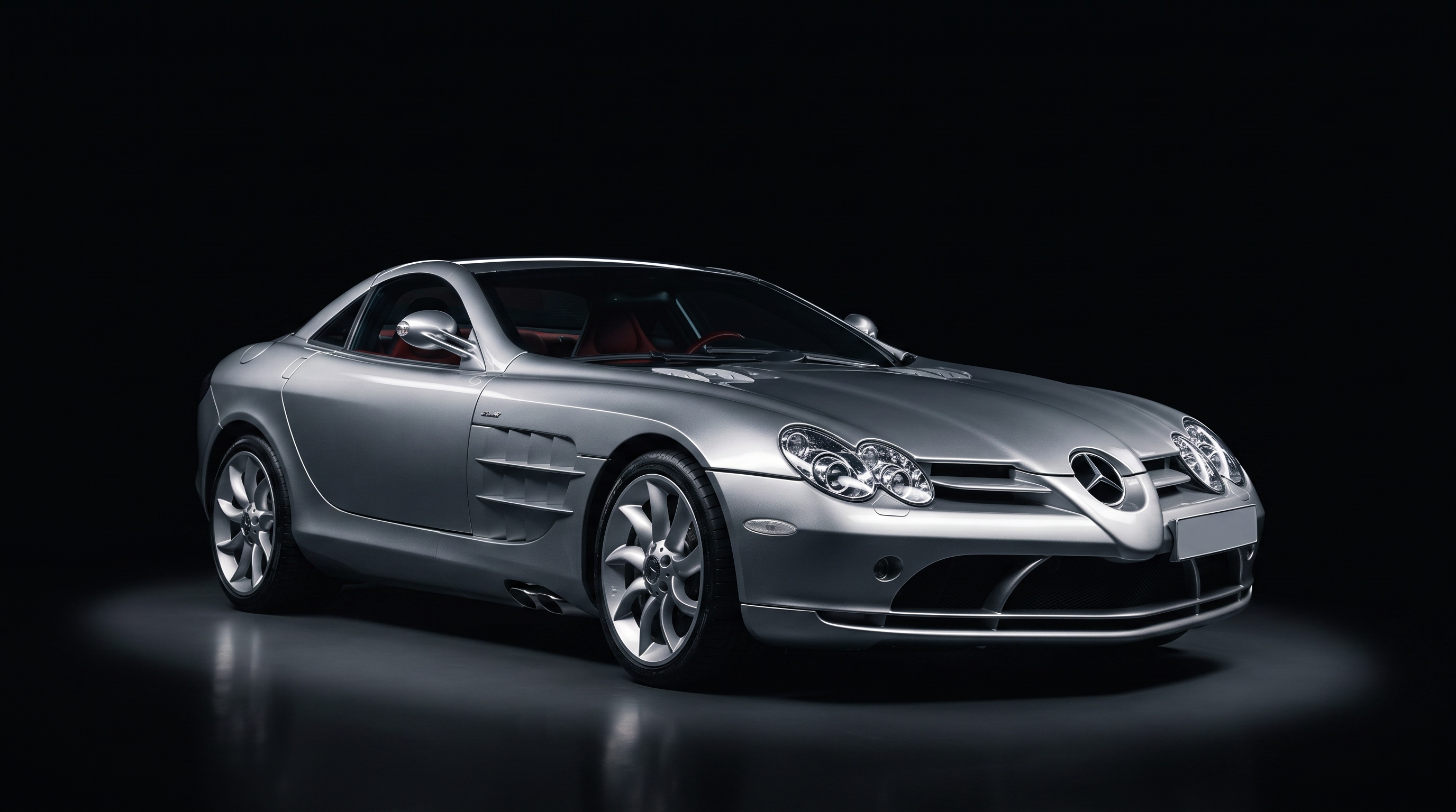 Silver Mercedes-Benz SLR McLaren in studio darkness