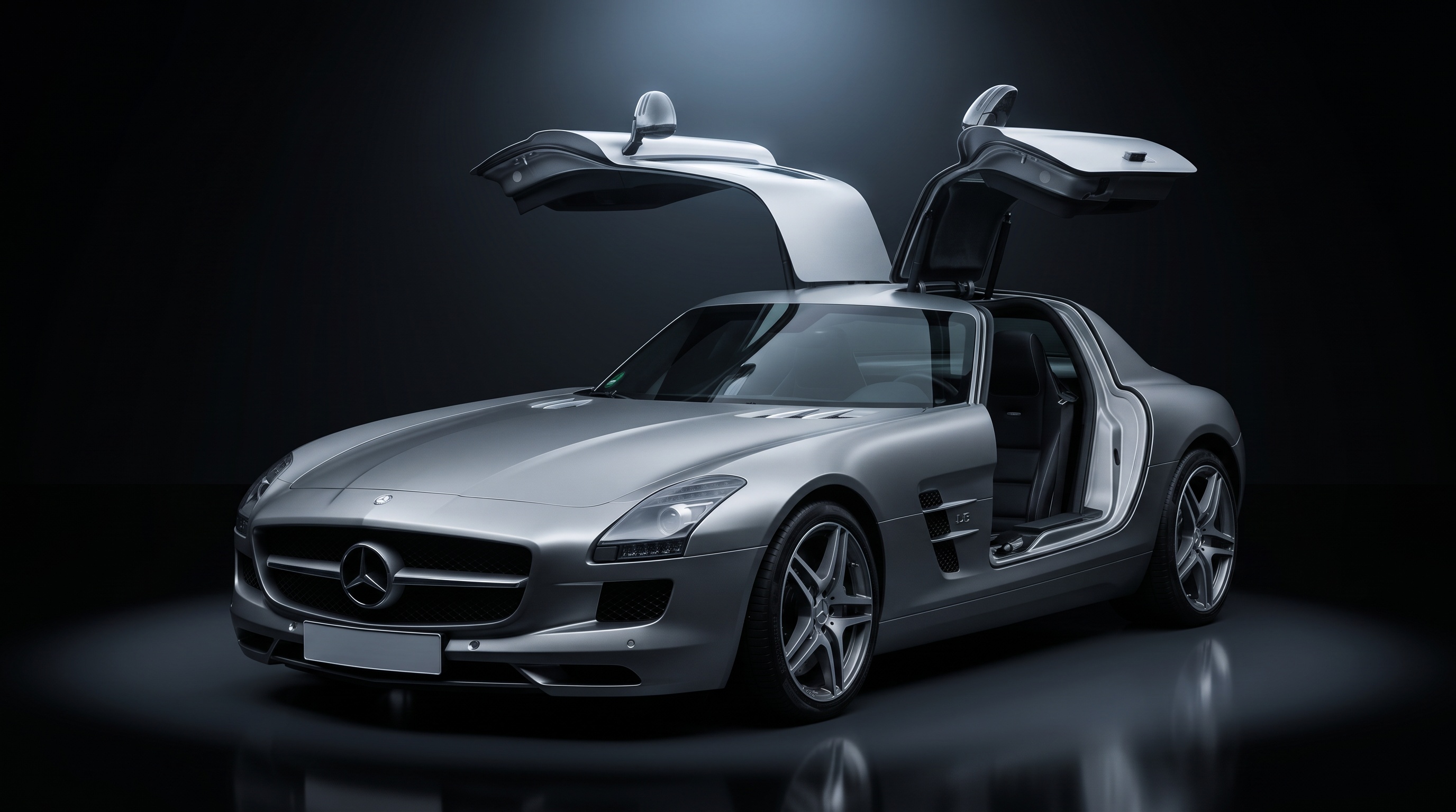 A silver Mercedes-Benz SLS AMG with both gullwing doors raised in a dark studio