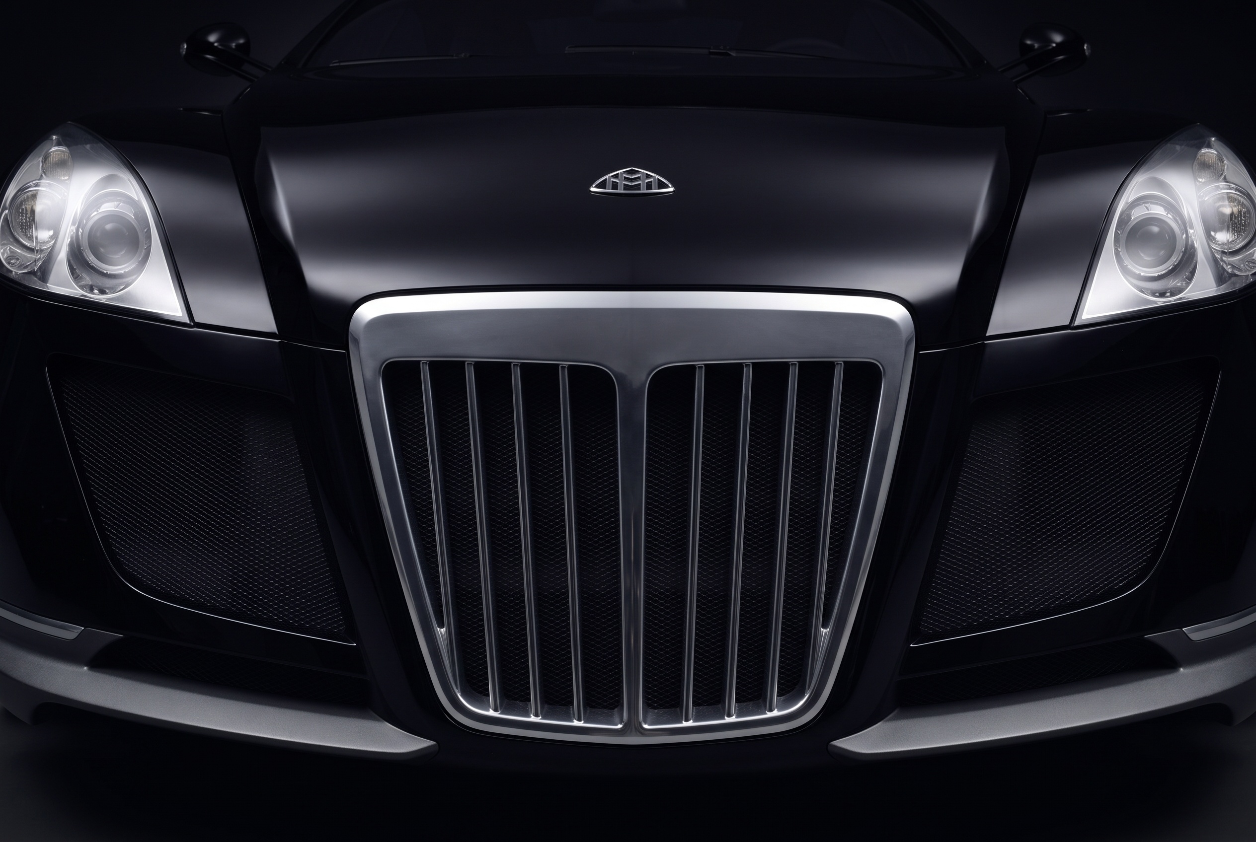 The Exelero's tall upright chrome grille and quad headlamps