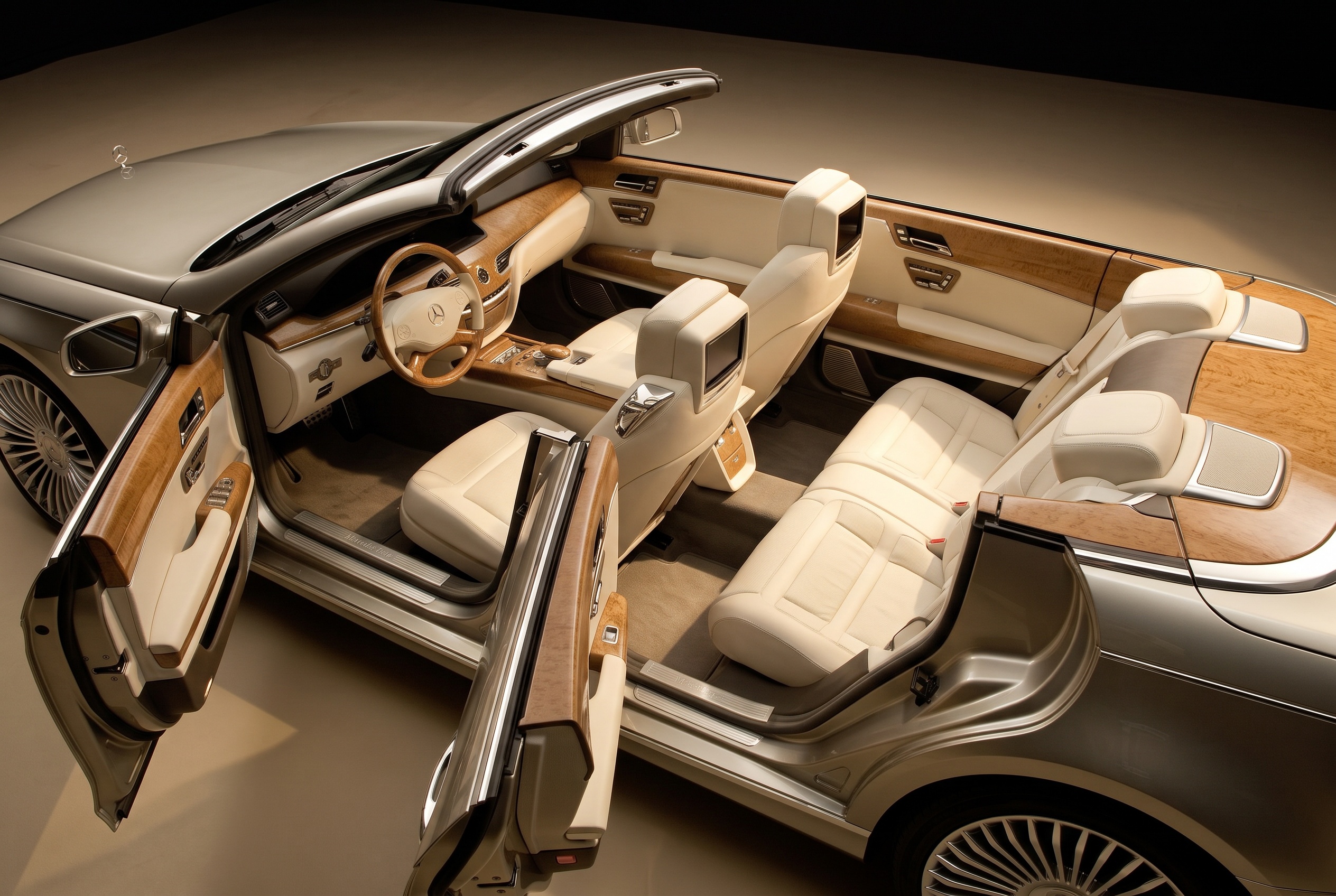 Ocean Drive cabin: four cream leather seats, bird's-eye maple trim and a wood-rimmed steering wheel